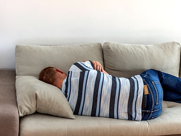 Person sleeping on sofa